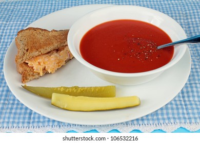 Pimento Cheese Spread On Toast With Cream Of Tomato Soup And Two Bread And Butter Pickle Spears.