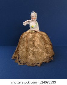 Pin Cushion Half Doll Lady On Blue Background