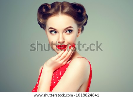 Pin up girl vintage. Wow expressions emotion! Beautiful woman pinup style portrait in retro dress and makeup, manicure nails hands, red lipstick and polka dot dress, surprised face.