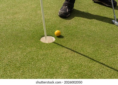 Pin, Hole And Ball Of A Minigolf Course.