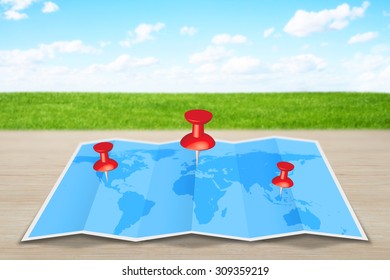 Pin map marker pointer icon on a blue world map