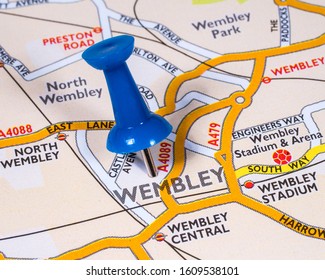 A pin marking the location of the town of Wembley on a map of the United Kingdom.  Wembley is a town located in the London Borough of Brent.
