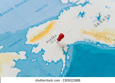 a pin on alaska, u.s., us, usa in the world map