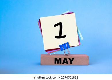 Pin On The Calendar Date Number - May 1st. Day 1 Of Month. Workplace At Blue Background With Copy Space. Spring Time. Labor Day