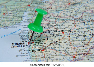 Pin Pointing On Mumbai On Atlas Map