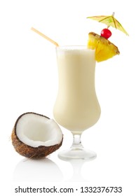 Pina colada cocktail with coconut in a tall glass on white background