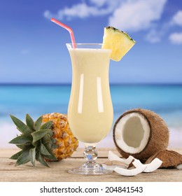 Pina Colada cocktail drink with fruits on the beach