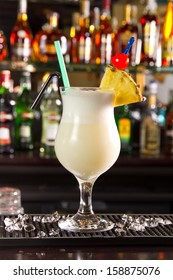 Pina colada cocktail on a bar counter