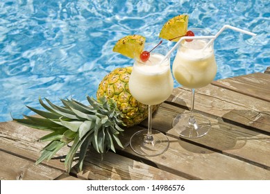 Pina Colada Cocktails By A Swimming Pool