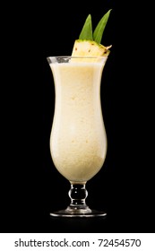 Pina colada drink cocktail glass isolated on black background