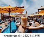 Pina Colada frozen cocktail on Carnival Cruise Line. Frozen drink being enjoyed on vacation. Cruise ship cocktail on pool deck. 