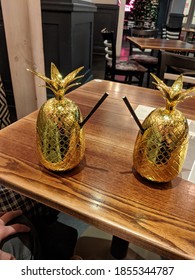 Pina-colada Cocktail In A Golden Pinapple.