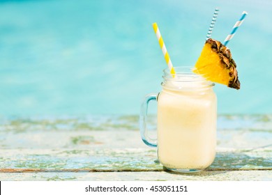 Pinacolada drink in cocktail jam on the beach