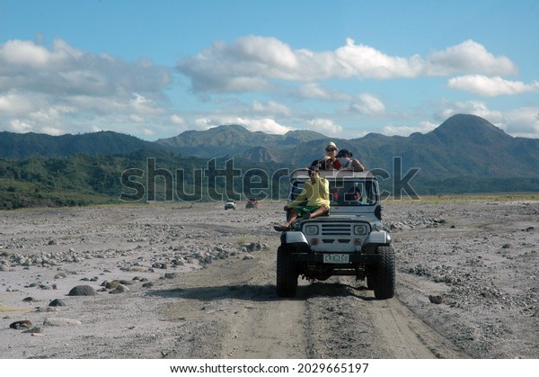 PINATUBO,\
PHILIPPINES - Nov 02, 2019: A car in the rough volcanic ash\
landscape in Pinatubo volcano,\
Philippines
