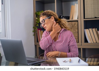 Pinched Nerves, Tensed Sore Muscles, Fibromyalgia Ache Due Sedentary Lifestyle And Incorrect Posture Concept. Caucasian Ethnicity Frowning Woman Sitting At Desk In Front Of Laptop, Touch Neck Pain