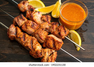 Pinchos Morunos - Spanish Pork Kebabs: Marinated Chunks Of Pork Tenderloin Grilled On Skewers And Served With Paprika Aioli And Lemon Wedges