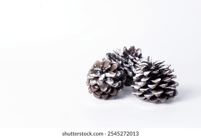 Pine cone with artificial snow for Christmas decoration. - Powered by Shutterstock