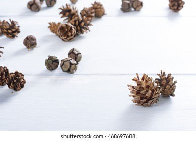 Pine Cones On White Wood Table, Purity Christmas Decoration