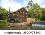 Pine Creek Grist Mill, built in 1848, on a sunny summer morning at Wildcat Den State Park.  Muscatine, Iowa, USA.