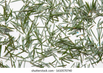 Pine Needles On A White Background Cleaning Up After Christmas Holiday