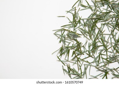 Pine Needles On A White Background Cleaning Up After Christmas Holiday