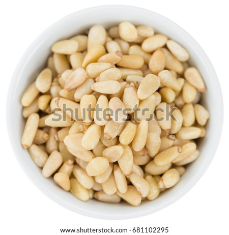 Pine Nuts isolated on white background (selective focus; close-up shot)