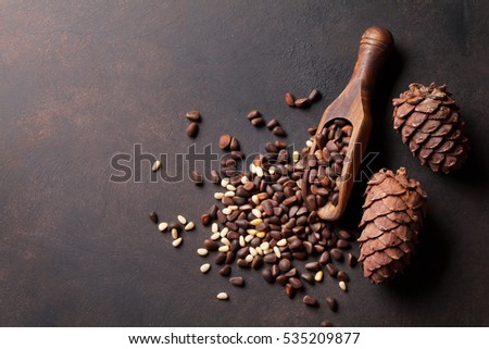 Pine nuts on stone table. Top view with copy space