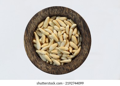 Pine Nuts In A Wooden Bowl. Pine Nuts Are The Edible Seeds Of Pines (family Pinaceae, Genus Pinus)	