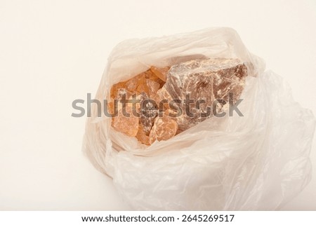 Pine rosin in a package. Solid pine resin flux for soldering.