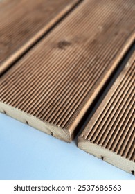Pine spruce decking boards feature a smooth, natural finish with warm, light hues, a fine grain pattern. Durable, resistant to moisture, ideal for outdoor spaces, providing a sturdy attractive surface