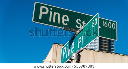 Pine street and Pike Place Market street sign at at Pike Place Public Market in Seattle : home to the original Starbucks coffee shop.