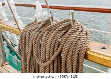 Pine trail with fixed running rigging. An old sailing ship. Closeup of the rigging of an old boat on a sunny day