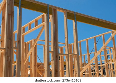 Pine wood stud wall frames on a house under construction in Australia; a symbol of the housing property crisis.