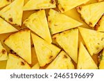 Pineapple background cut into triangles. Close up, top view.