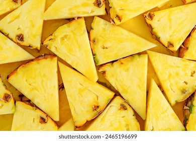 Pineapple background cut into triangles. Close up, top view. - Powered by Shutterstock