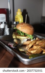 Pineapple Cheese Burger With Fries Cole Slaw And A Pickle