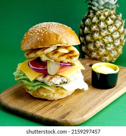 Pineapple Chicken Burger On Green Background