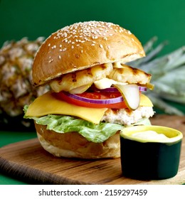 Pineapple Chicken Burger On Green Background