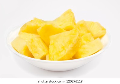 Pineapple Chunks In The Bowl Isolated On White