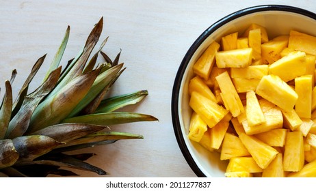 Pineapple Chunks Top View. Bowl Full Of Fresh Pineapple Cut Into Pieces.