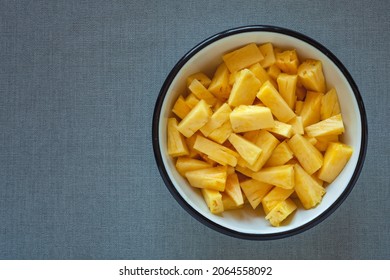 Pineapple Chunks Top View. Bowl Full Of Fresh Pineapple Cut Into Pieces.