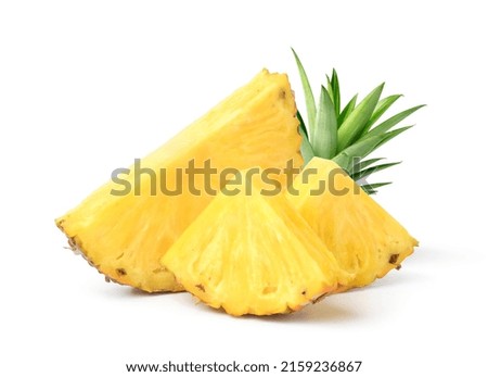Pineapple with cut in half and slices isolated on white background.