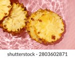 Pineapple floating in clean, moving water.