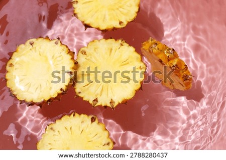 Pineapple floating in clean, moving water.