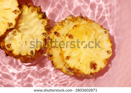 Pineapple floating in clean, moving water.