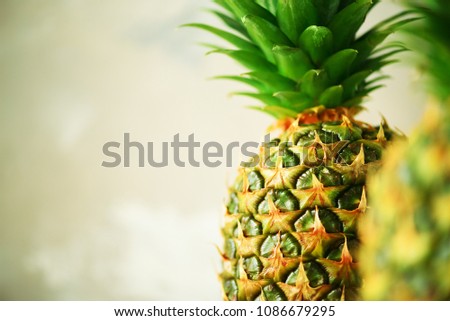 Pineapple fruit background. Close up of tropical pineapples texture. Summer, holiday concept. Raw, vegan, vegetarian, clean eating diet