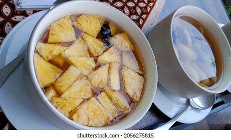 Pineapple Fruit Compote Served In A White Ceramic Bowls. 