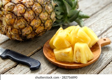 Pineapple fruit cut on wooden - Powered by Shutterstock