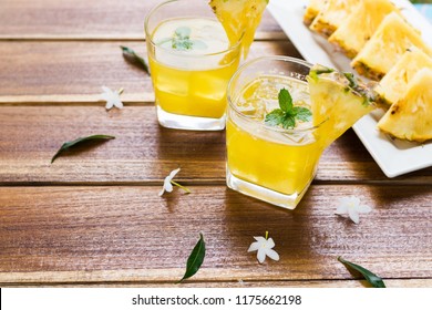 Pineapple Fruits Drink On Wooden Background.