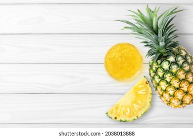 Pineapple Jam In Glass Jar And Fresh Pineapple Fruit Isolated On Gray Wooden Table Background. Top View. Flat Lay.